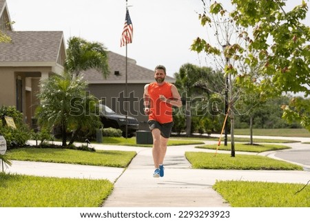 smiling sport runner run outdoor. sport runner having run workout. photo of sport runner run.