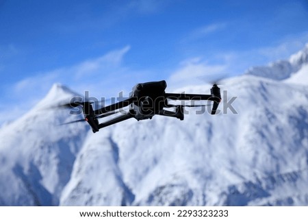 Flying drone in high altitude mountains