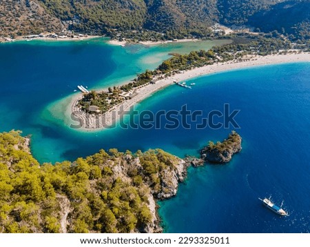 Aerial drone photo of Ölüdeniz, Fethiye, Turkey, showcasing the turquoise waters, picturesque coastline, and beautiful beaches of this popular summer destination. Royalty-Free Stock Photo #2293325011