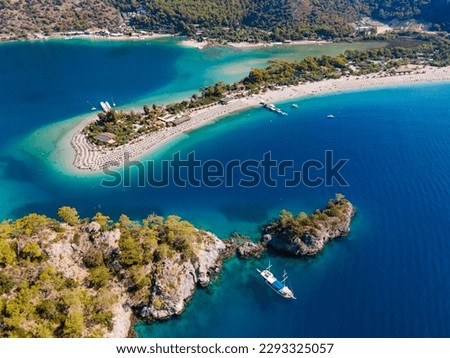 Aerial drone photo of Ölüdeniz, Fethiye, Turkey, showcasing the turquoise waters, picturesque coastline, and beautiful beaches of this popular summer destination. Royalty-Free Stock Photo #2293325057
