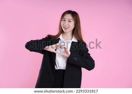 image of businesswoman posing on pink background