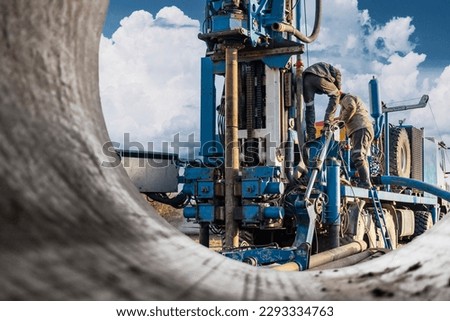 Drilling rig repair and maintenance. Preparation for drilling operations. Drilling of deep wells. Exploration work. Mineral exploration. Extraction of gas and oil Royalty-Free Stock Photo #2293334763