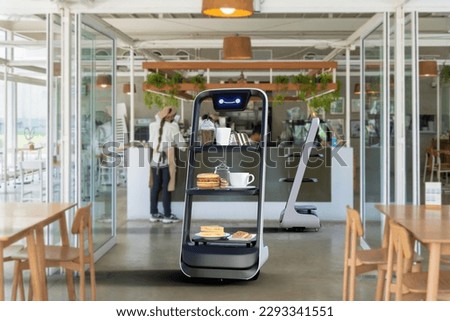 Autonomous waiter robot working in restaurant, Artificial intelligence 5G technology concept Royalty-Free Stock Photo #2293341551