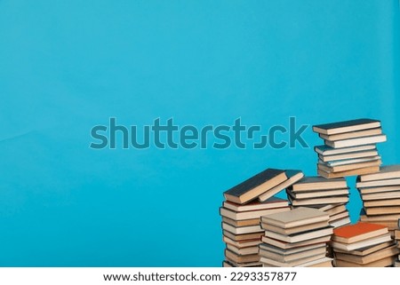 learning library science stack of books on blue background