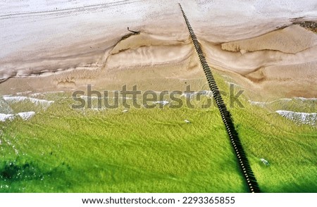 Abstract graphic aerial view of a pier and the sandy beach on the Baltic Sea coast in Poland