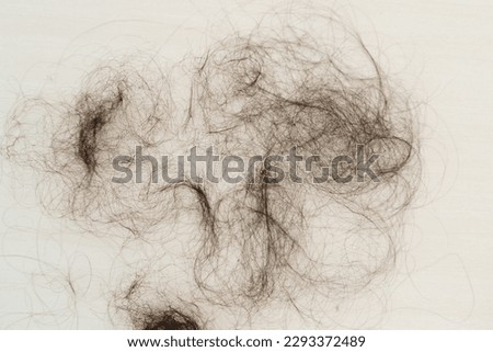 unhealthy hair loss on a floor Royalty-Free Stock Photo #2293372489
