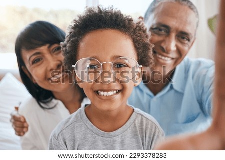 Glasses, grandparents and selfie smile with kid in home living room, bonding and having fun. Photo, happiness and portrait of child with grandma and grandpa taking face pictures for family memory.