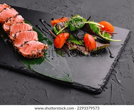 Salmon tataki in sesame with salad Royalty-Free Stock Photo #2293379573