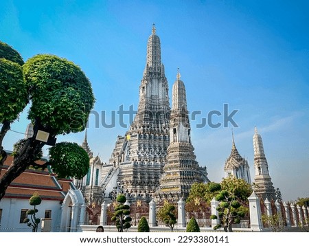 The visiting card of the capital of Thailand is the Buddhist temple Wat Arun, Temple of Dawn, which is located on the banks of the Chao Phraya River. Royalty-Free Stock Photo #2293380141