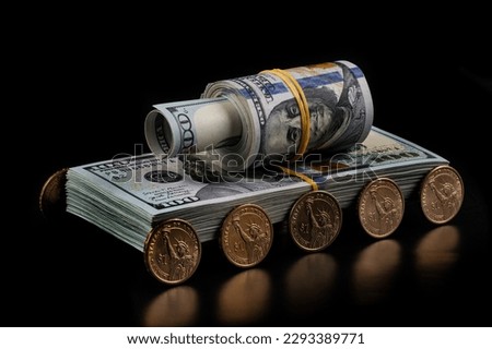Conceptual plot about the profit of the military-industrial complex with a tank made from american dollars Royalty-Free Stock Photo #2293389771