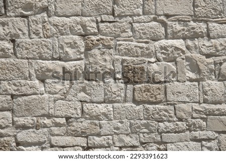 ancient white stone wall of a house