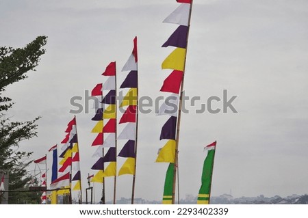 Rows of colorful flag installed to enliven the Carbit Cannon event which is held to enliven the Takbir night of Eid al-Fitr.