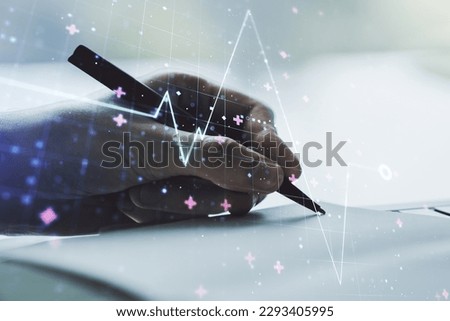 Double exposure of creative abstract heart rate hologram and man hand writing in notebook on background. Healthcare technolody concept