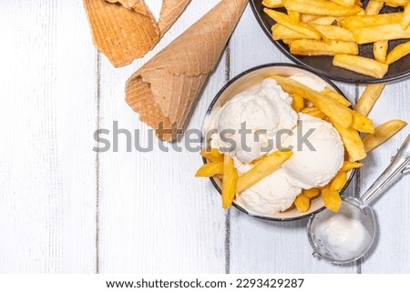 Trendy french fries ice cream, Vanilla icecream with original french fries potato flavor, white wooden background copy space