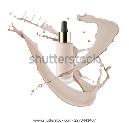 Liquid foundation in bottle and splashes of makeup product on light background