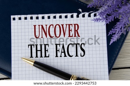 UNCOVER THE FACTS - words on a white sheet with a black notepad and pen. Info concept