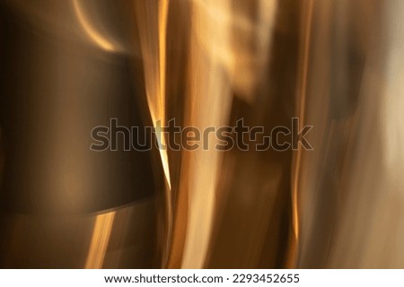 abstract blurred golden, yellow, white, orange, and bronze mysterious festive background