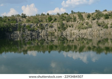 view of the lake with rocky mountains