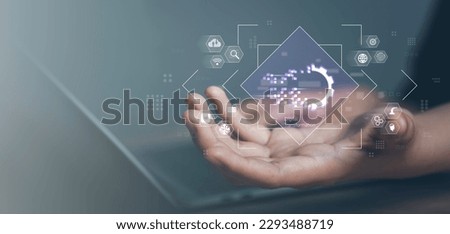 Digital transformation concept. Connection next generation technology era. Businessman holding futuristic blue gear digital transform  growth business and modern artificial intelligence and big data. Royalty-Free Stock Photo #2293488719
