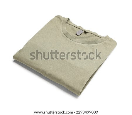 Folded green t-shirt on white background