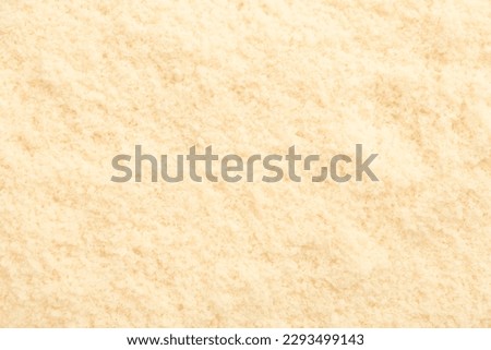 Tasty grated Parmesan cheese as background, closeup Royalty-Free Stock Photo #2293499143