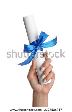 Woman holding diploma with ribbon on white background Royalty-Free Stock Photo #2293506317