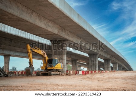 Excavator in construction site at road construction site at highway. Excavators. Royalty-Free Stock Photo #2293519423