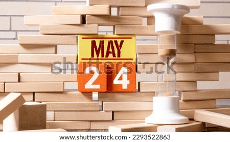 May 24 calendar made wooden cubes gray background.With an empty space for your text.