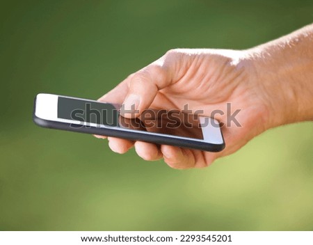 Information has never been more accessible. Shot of an unrecognisable man using a smartphone outdoors.
