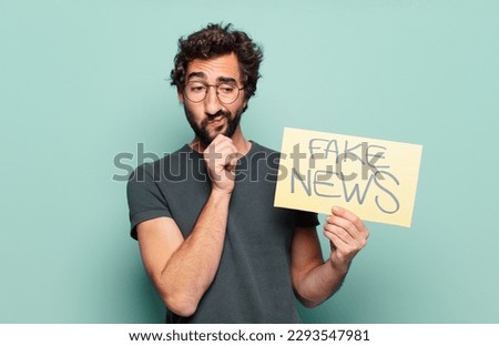 young bearded man fake news concept Royalty-Free Stock Photo #2293547981