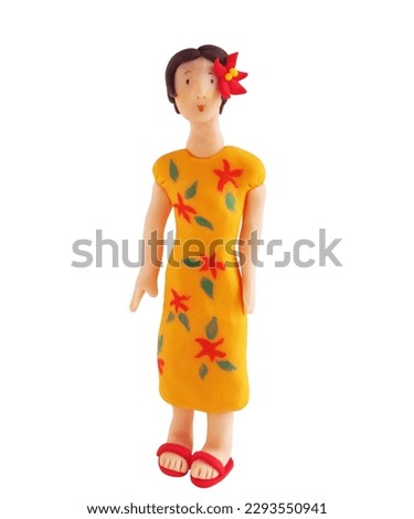 Woman in floral dress(This is a photo of a clay work)