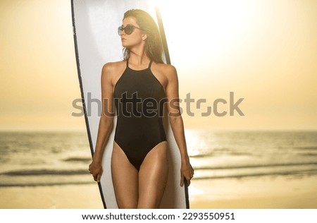 Girl surfer on vacation. Download a photo with copy space to advertise tours to a warm country. Surfing and travel picture for social media promo.