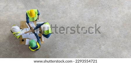 Top view of engineer, architect, contractor and foreman having unity agreement meeting at the construction building site with floor plan for real estate development project industry and housing usage