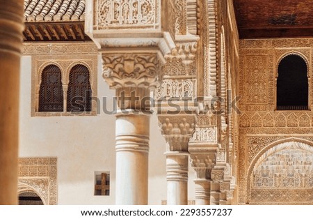  Marble capitals and stucco decoration of the portico in Court of Myrtles in Comares Palace Alhambra, Andalusia, Spain. Magic breathtaking carved decoration in Orient style.