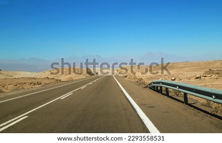 Empty Road with a Signpost in the Arid Desert of Atacama Desert, Antofagasta Region, Northern Chile, South America Royalty-Free Stock Photo #2293558531