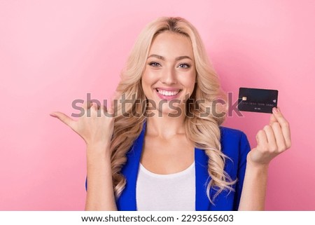 Photo of young bank manager attractive woman hold plastic credit card direct finger mockup shopping cashback isolated on pink color background