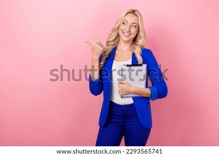Photo of charming corporate agent girl hold tablet look direct finger empty space isolated on pink color background