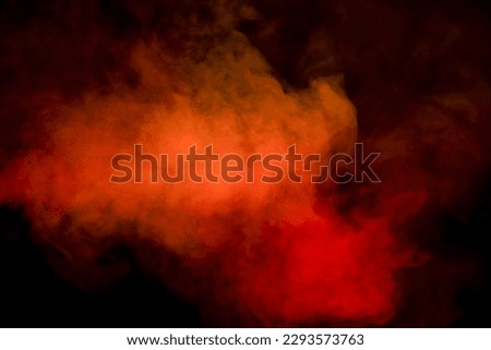 Orange and red steam on a black background. Copy space. Royalty-Free Stock Photo #2293573763