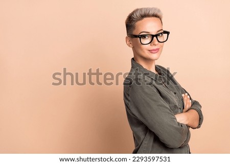 Photo of ceo director company young woman blonde short hairstyle wear stylish khaki shirt folded hands isolated on beige color background Royalty-Free Stock Photo #2293597531