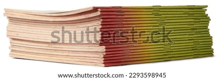 stack of paperback thin books or booklets isolated on white background, selective focus cut out