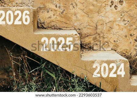Countdown to 2026. up on wooden stair from the year 2024 to 2026. The business growth process for goal. Christmas and Happy New year Royalty-Free Stock Photo #2293603537