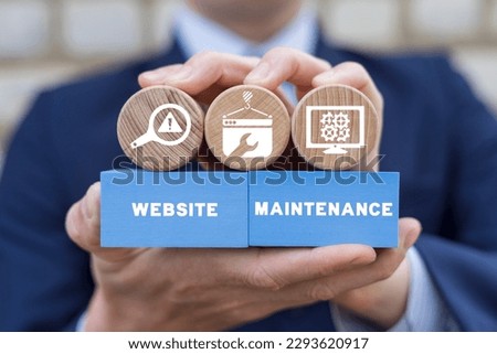 Man holding colorful blocks with inscription: WEBSITE MAINTENANCE. Website under construction page. Website under maintenance page. Web Page Under maintenance.