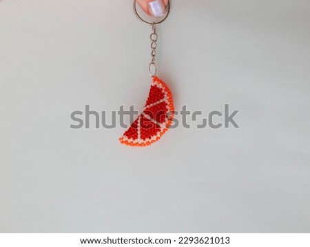 Bead colorful key chain on a white. Colorful bead key chain on a white background