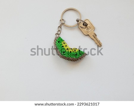 Colorful bead key chain on a white background. Colorful key chain on a white