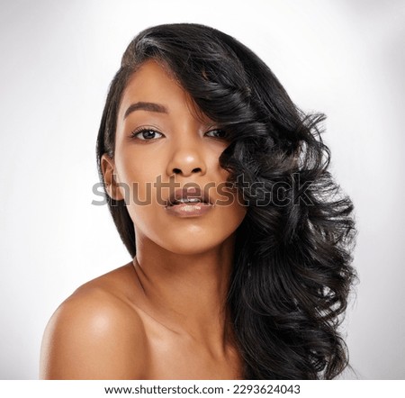 If you dont love yourself, now is the time to start. Shot of a beautiful young woman posing against a grey background.