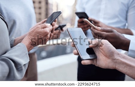 When were connected, everyone stays updated. Cropped shot of a group of unrecognizable businesspeople using their cellphones. Royalty-Free Stock Photo #2293624715