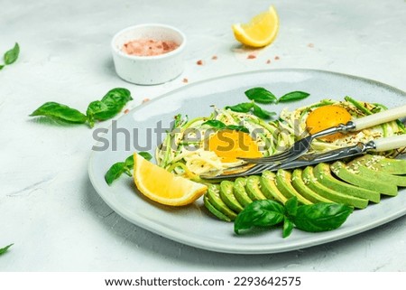 zucchini with eggs and avocado. breakfast. Healthy food, ketogenic diet, diet lunch concept. place for text, top view.