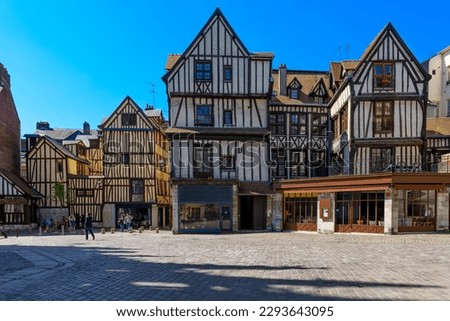 Street with timber framing houses in Rouen, Normandy, France. Architecture and landmarks of Rouen. Cozy cityscape of Rouen Royalty-Free Stock Photo #2293643095