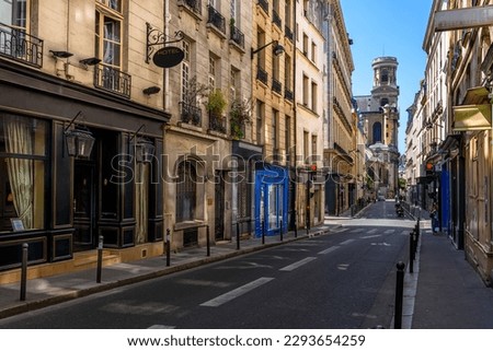 Cozy street in Paris, France. Cityscape of Paris. Architecture and landmarks of Paris Royalty-Free Stock Photo #2293654259
