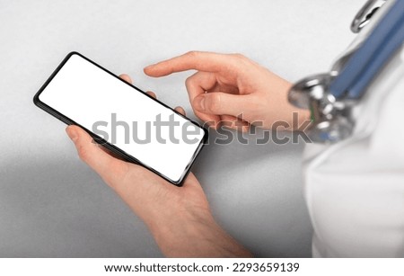 Doctor hand using medical phone screen mockup closeup